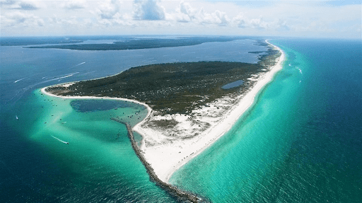 Aerial view of a sandy spit ideal for pontoon rentals in Panama City.